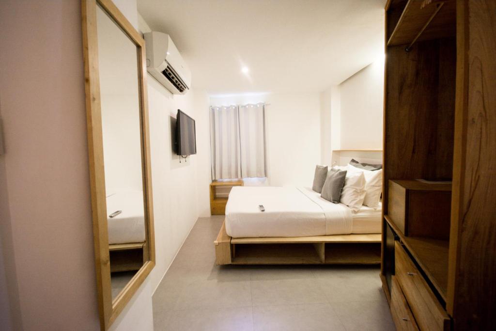 Postel nebo postele na pokoji v ubytování Zuzuni Boutique Hotel
