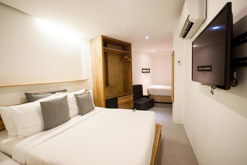 TV a/nebo společenská místnost v ubytování Zuzuni Boutique Hotel