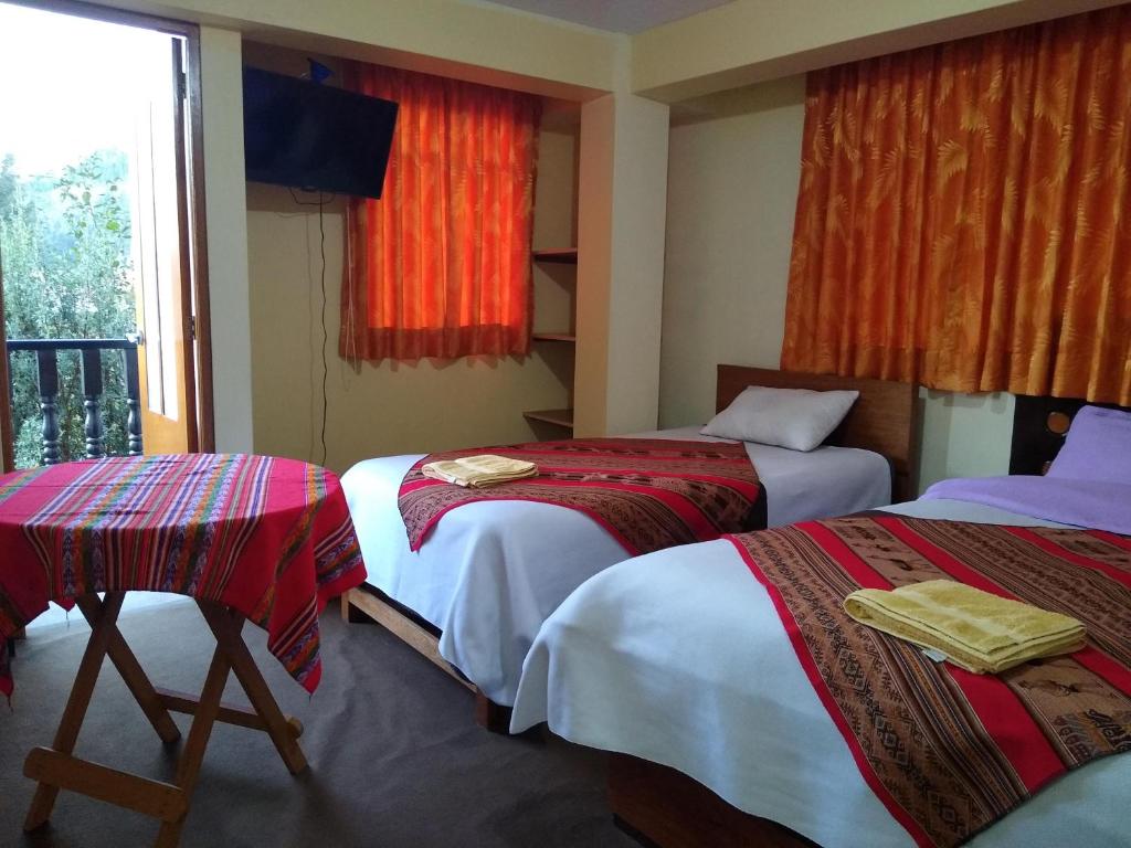 Postel nebo postele na pokoji v ubytování Hostal Casa del Montañista