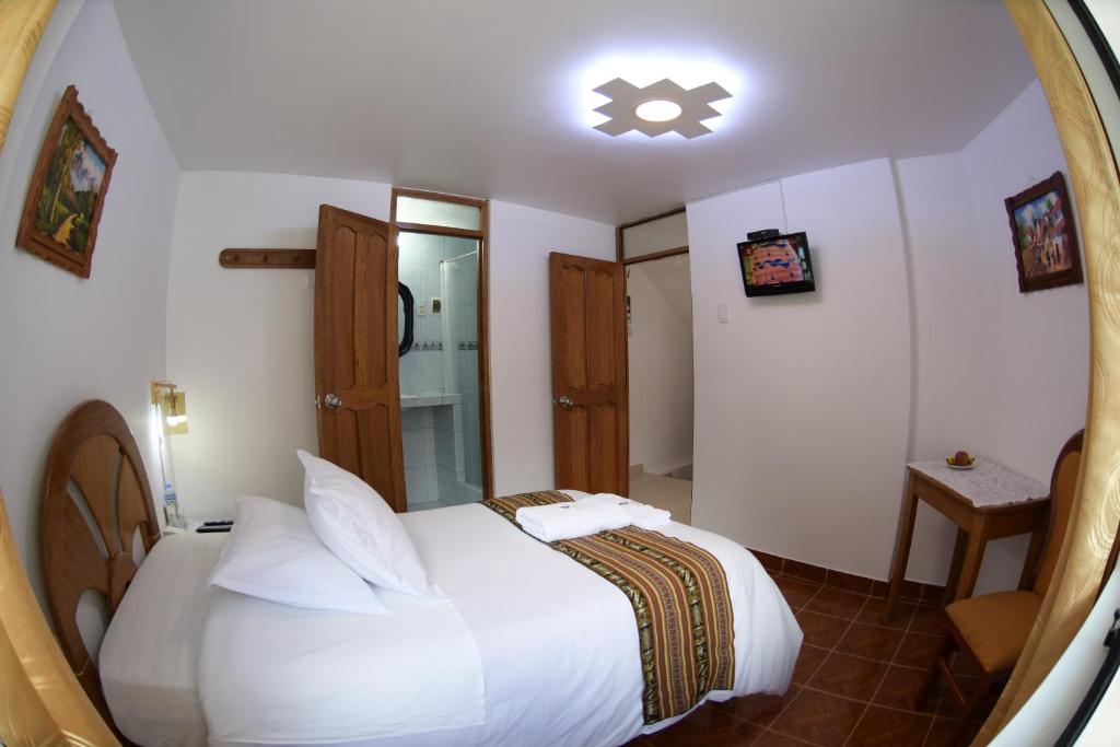 Postel nebo postele na pokoji v ubytování MAPILAND- Hotel Boutique