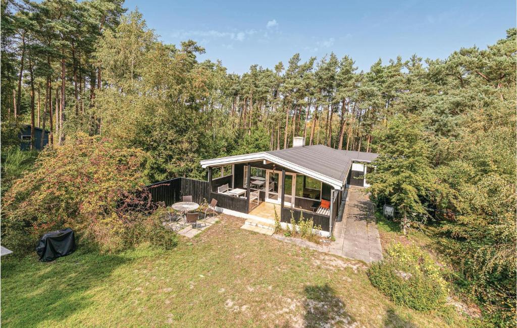 an overhead view of a house in the woods at Nice Home In Aakirkeby With 3 Bedrooms And Wifi in Vester Sømarken