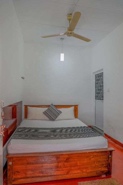 Ein Bett oder Betten in einem Zimmer der Unterkunft Bon Voyaage Tourist Inn