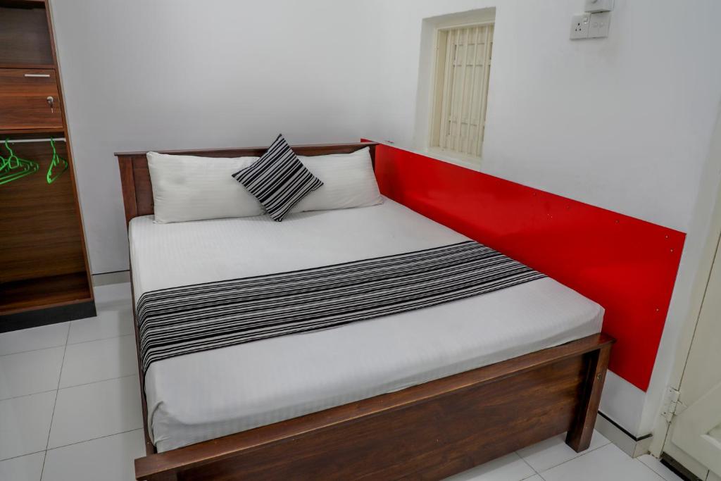 Ein Bett oder Betten in einem Zimmer der Unterkunft Bon Voyaage Tourist Inn