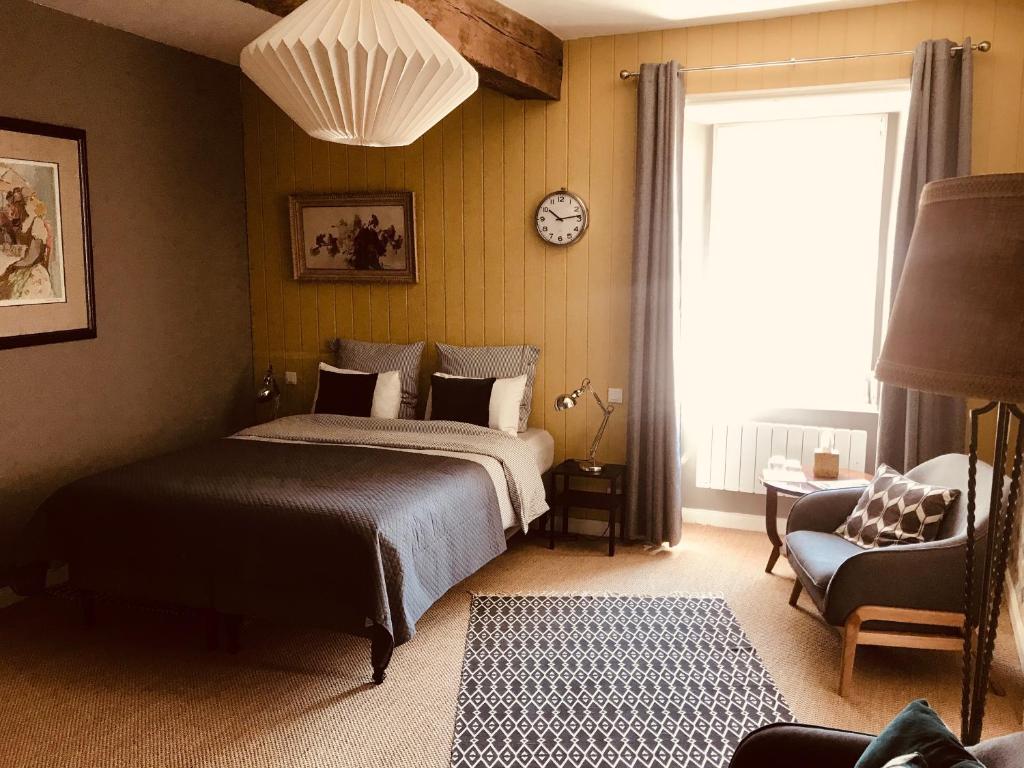 Postel nebo postele na pokoji v ubytování B&B du Cloître
