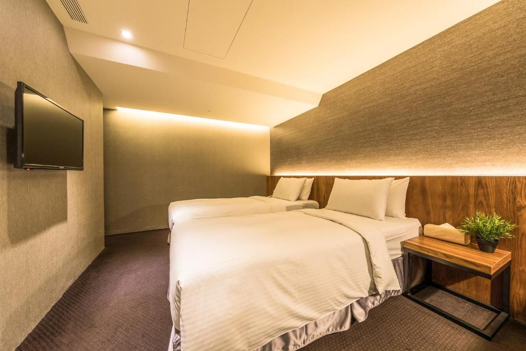 TV a/nebo společenská místnost v ubytování Goodmore Hotel