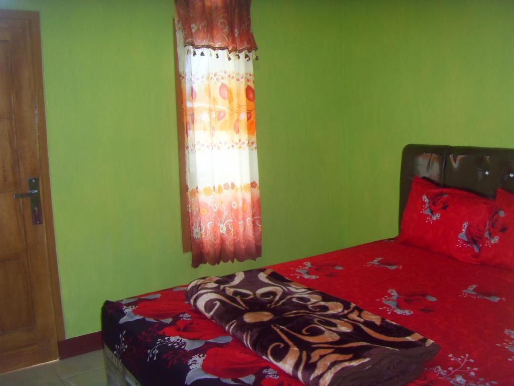 Postel nebo postele na pokoji v ubytování Cahyo Homestay Bromo