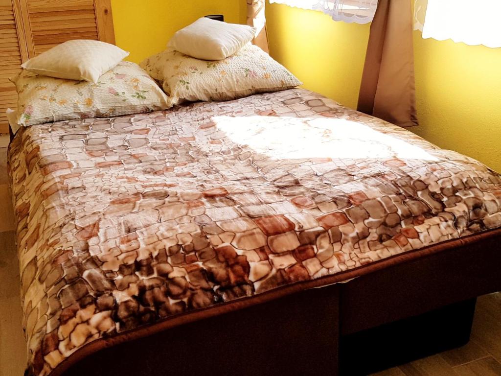 Posteľ alebo postele v izbe v ubytovaní Apartament Grota