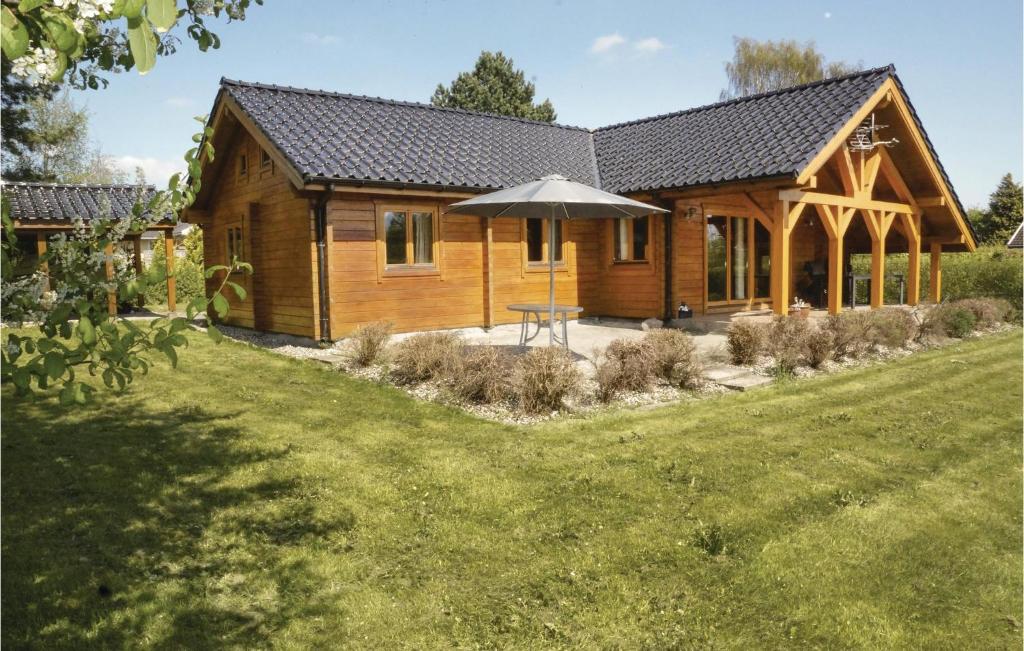 Κήπος έξω από το Four-Bedroom Holiday Home In Hesselager