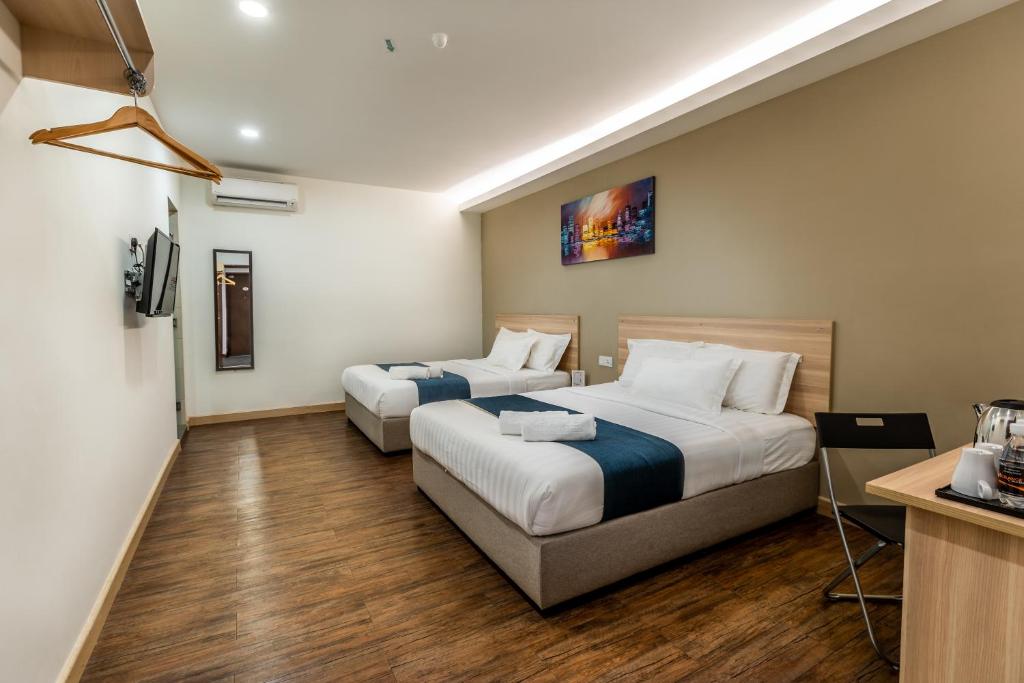 Postel nebo postele na pokoji v ubytování 1 Orange Hotel KLIA & KLIA2