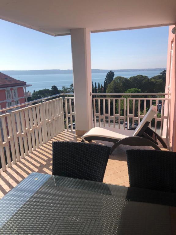 a balcony with chairs and a view of the ocean at Sea view apartment Jadranka in Portorož