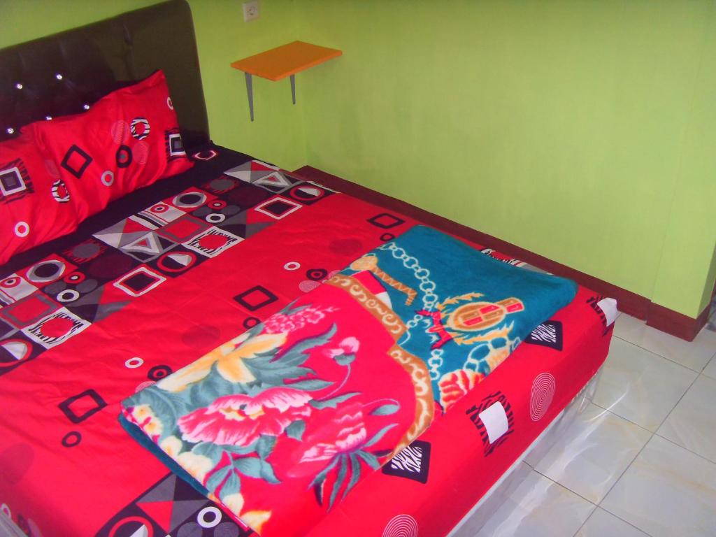 Postel nebo postele na pokoji v ubytování Cahyo Homestay Bromo