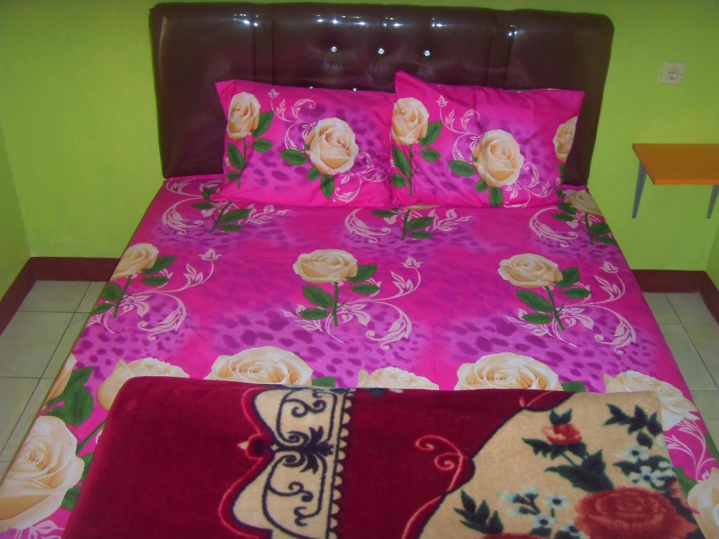 Postel nebo postele na pokoji v ubytování Cahyo Homestay Bromo