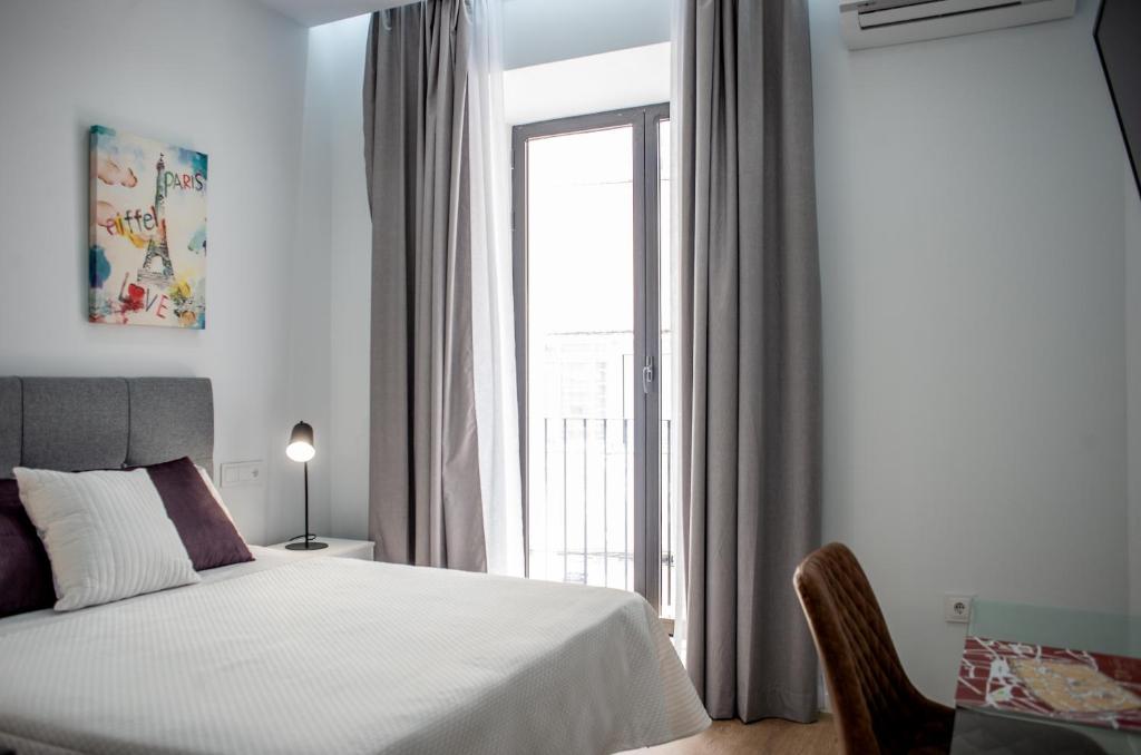 Posteľ alebo postele v izbe v ubytovaní Apartamentos Turísticos Moret11-1B