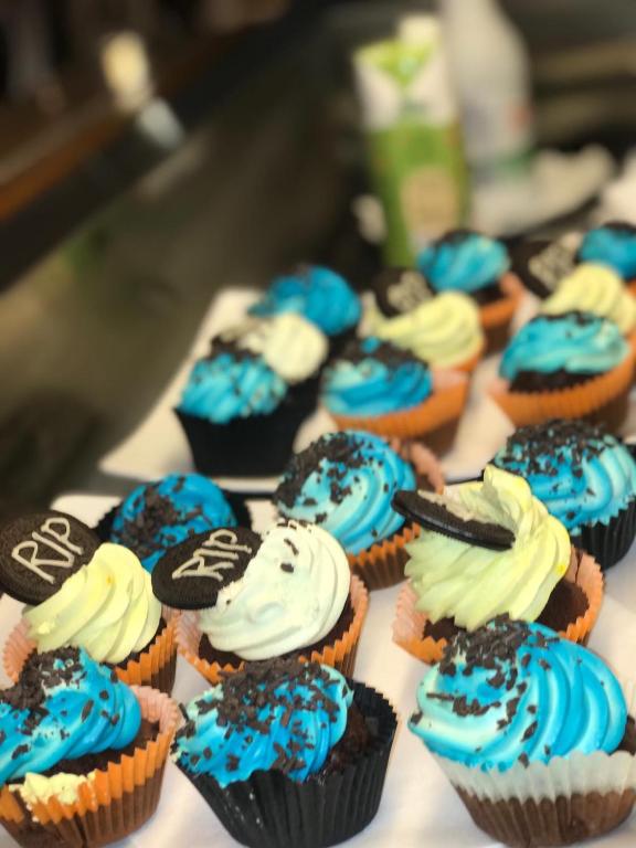 a group of cupcakes with blue and white frosting at Hotel Milanese in Rimini