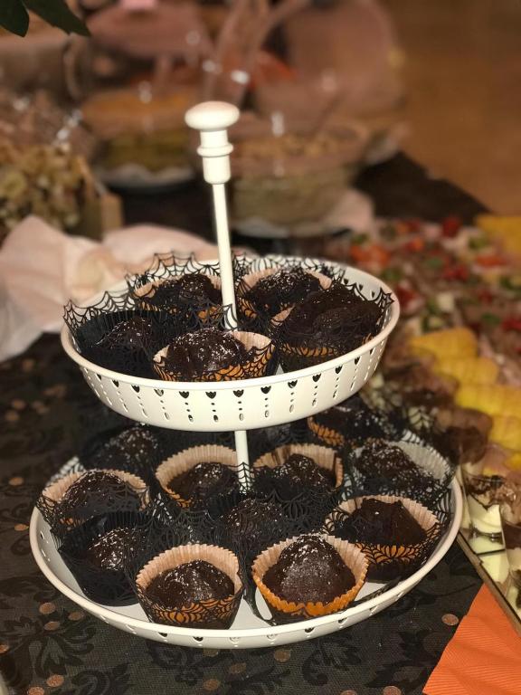 a bowl of cookies sitting on top of a table at Hotel Milanese in Rimini