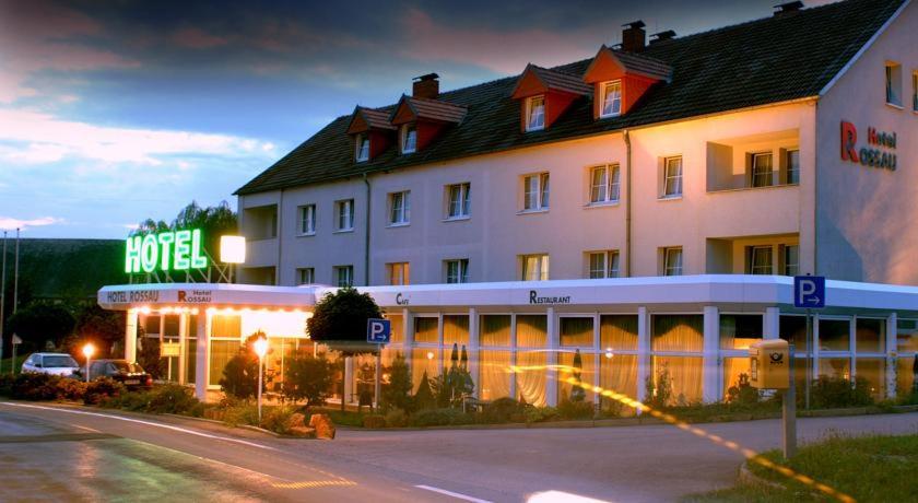 a large hotel with a sign in front of it at Edit Pension Rossau in Rossau