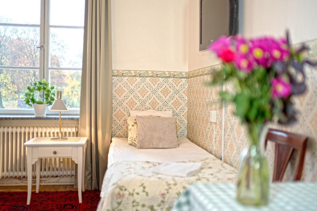 Postel nebo postele na pokoji v ubytování Wasa Park Hotel