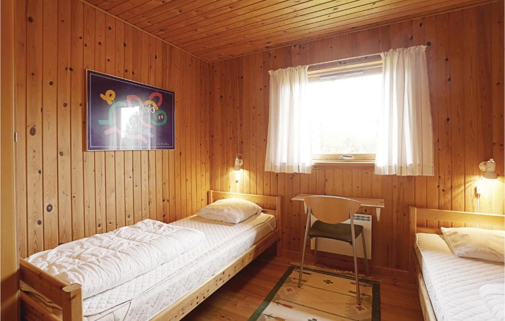 Postel nebo postele na pokoji v ubytování Holiday Home Nørreløkke Gudhjem Xi