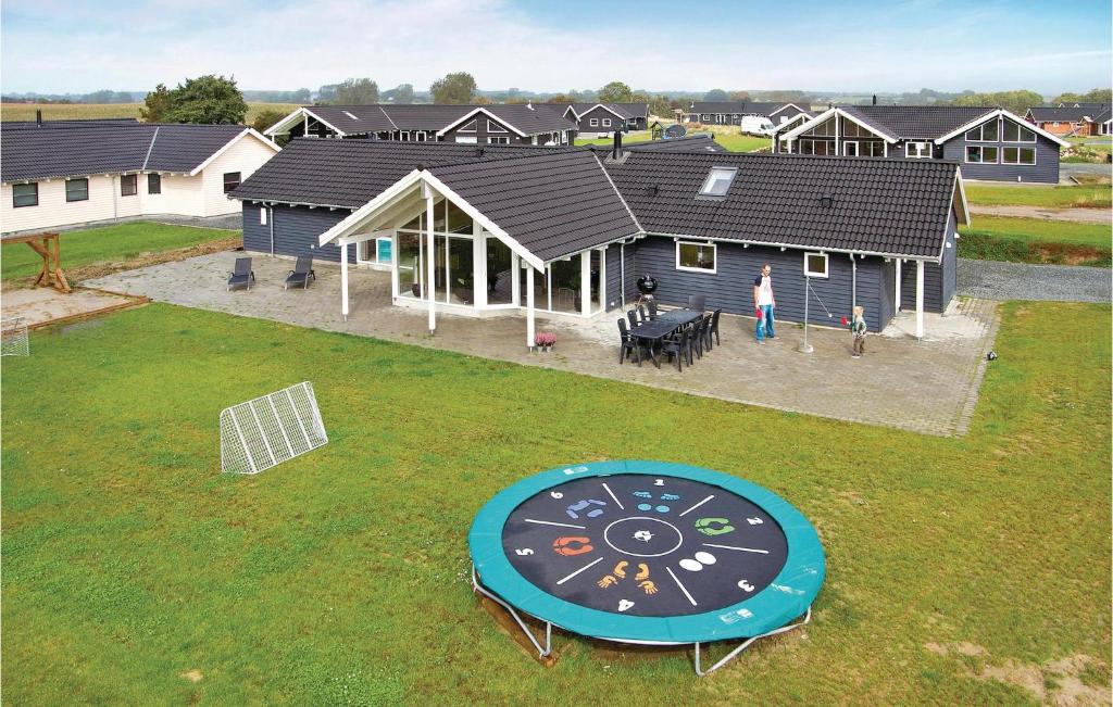 an aerial view of a house with a playground at Nice Home In Sydals With Sauna in Høruphav