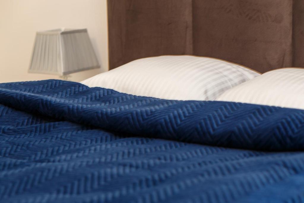 Posteľ alebo postele v izbe v ubytovaní KDRO Apartment Rynek
