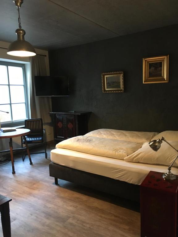 Postel nebo postele na pokoji v ubytování Hugos Haus & Berthas Haus