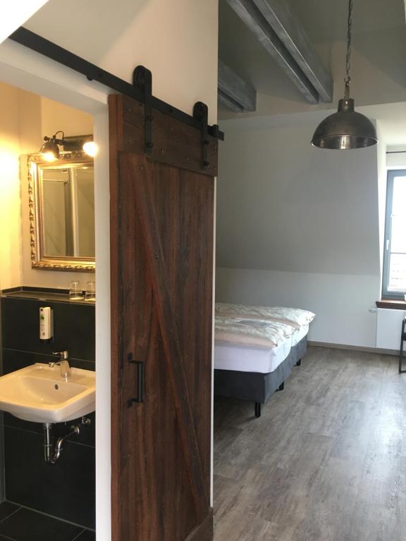 Postel nebo postele na pokoji v ubytování Hugos Haus & Berthas Haus