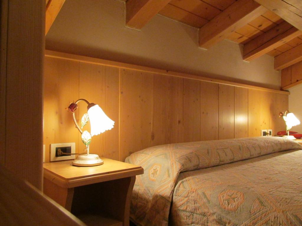 Postel nebo postele na pokoji v ubytování Hotel Garnì Miramonti