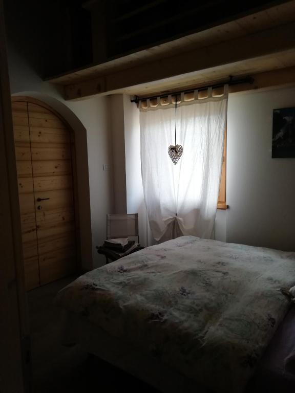 Postel nebo postele na pokoji v ubytování CastelCharme b&b