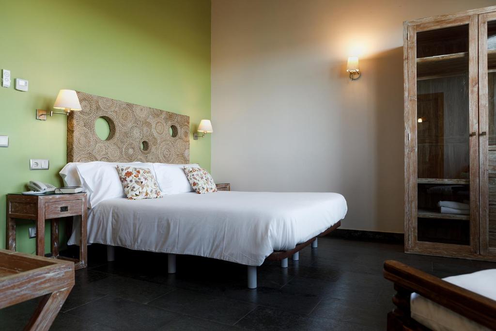 Postel nebo postele na pokoji v ubytování Eco Hotel Boutique & Spa Capitulo Trece - Adults Only