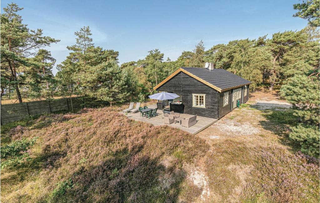 an aerial view of a cabin in the woods at Grshytten in Bedegård