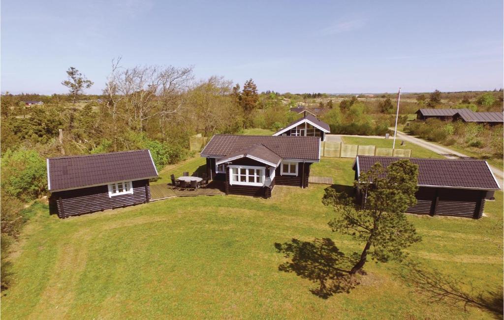 an aerial view of a house with a yard at Two-Bedroom Holiday Home In Skjern in Halby