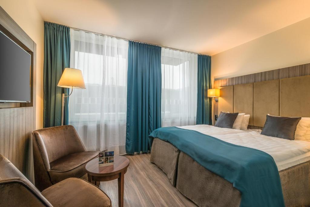 Postel nebo postele na pokoji v ubytování Hotel Oxelösund