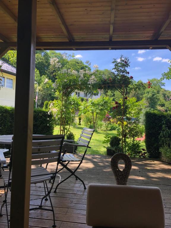 a view of a patio with a bench and a table at Komfort Ferienwohnung à la Bella in Mechernich