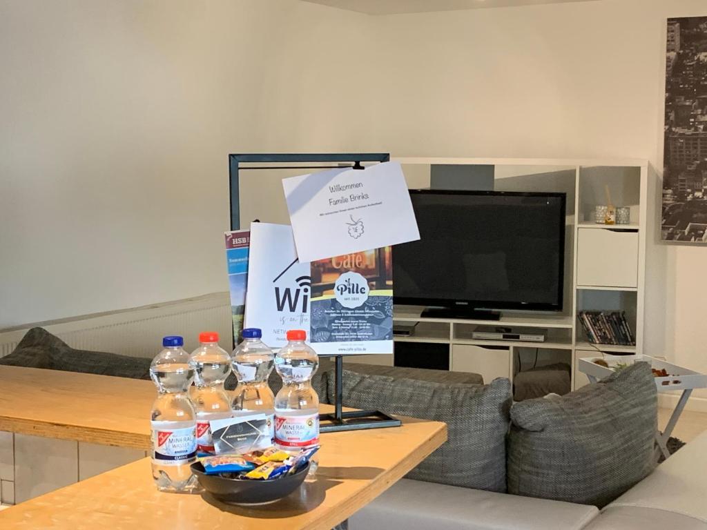 a table with a bunch of water bottles on it at 3-Sterne-Ferienwohnung Beer in Sondershausen