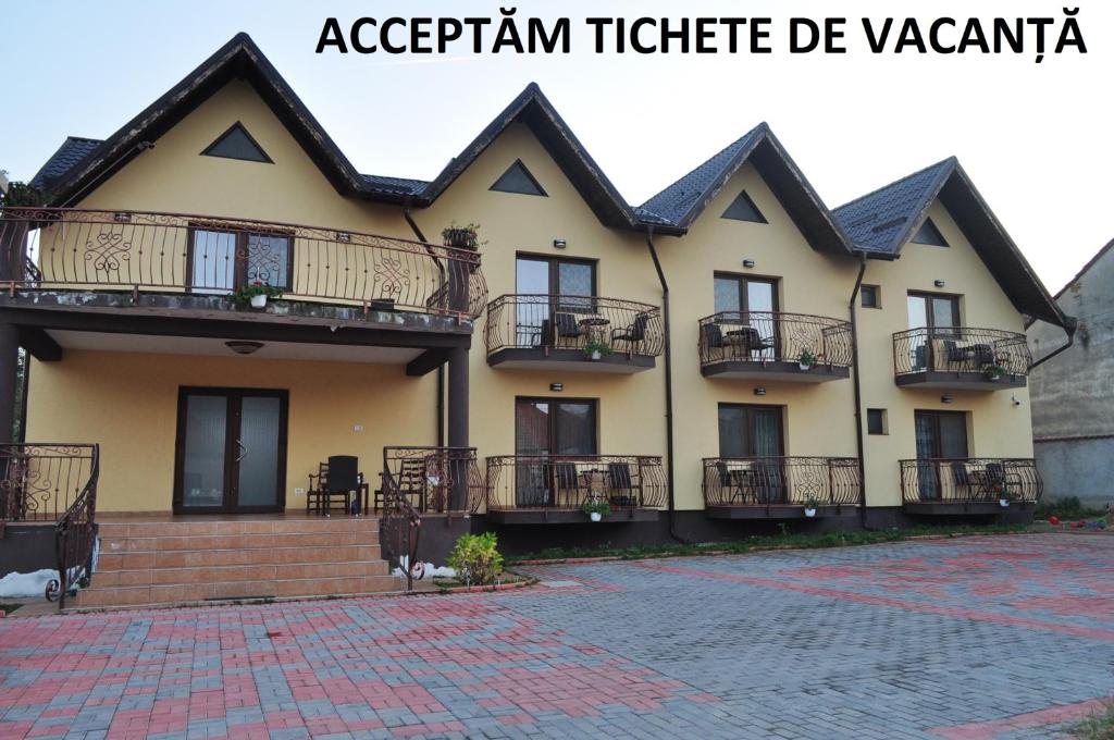 a house with balconies on the side of it at Vila Teoharie in Ocnele Mari