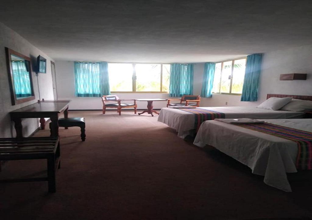 Postel nebo postele na pokoji v ubytování Hotel El Doral