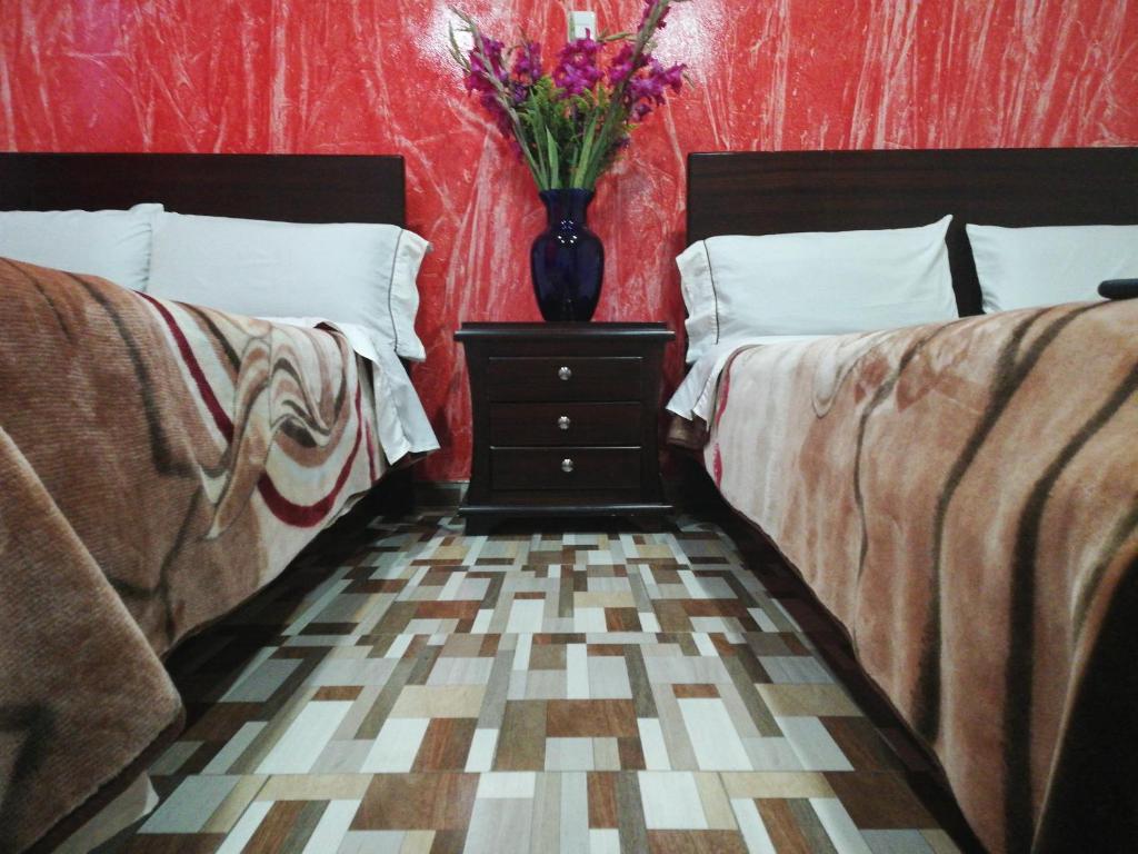 Postel nebo postele na pokoji v ubytování Hotel Gun Glub