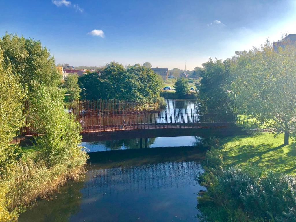 an overhead view of a bridge over a river at 1 room studio with wonderful view in Den Helder