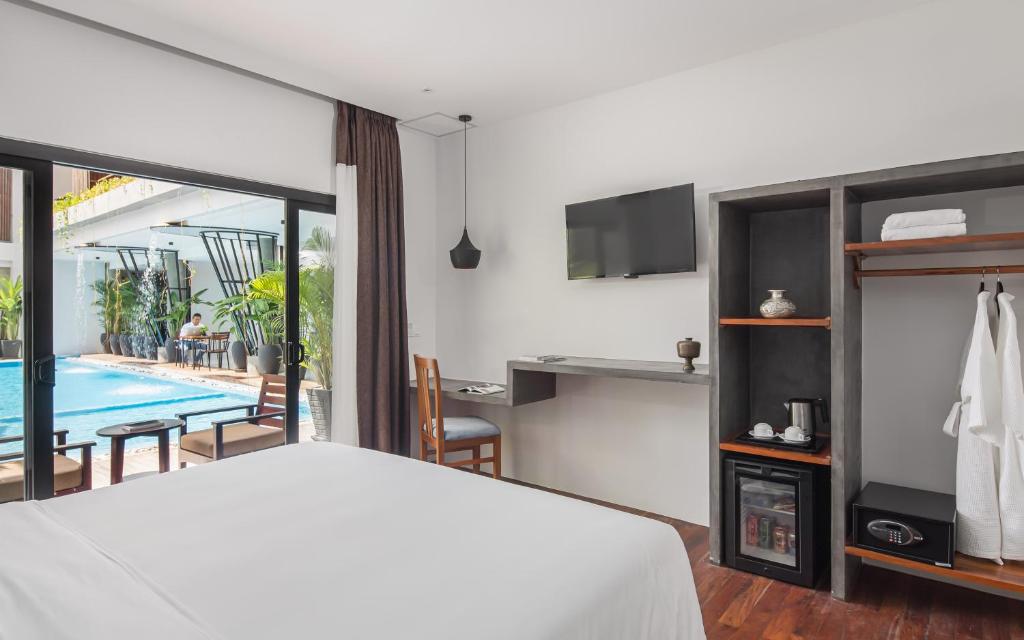 Postel nebo postele na pokoji v ubytování Siem Reap Palace Hotel & Spa