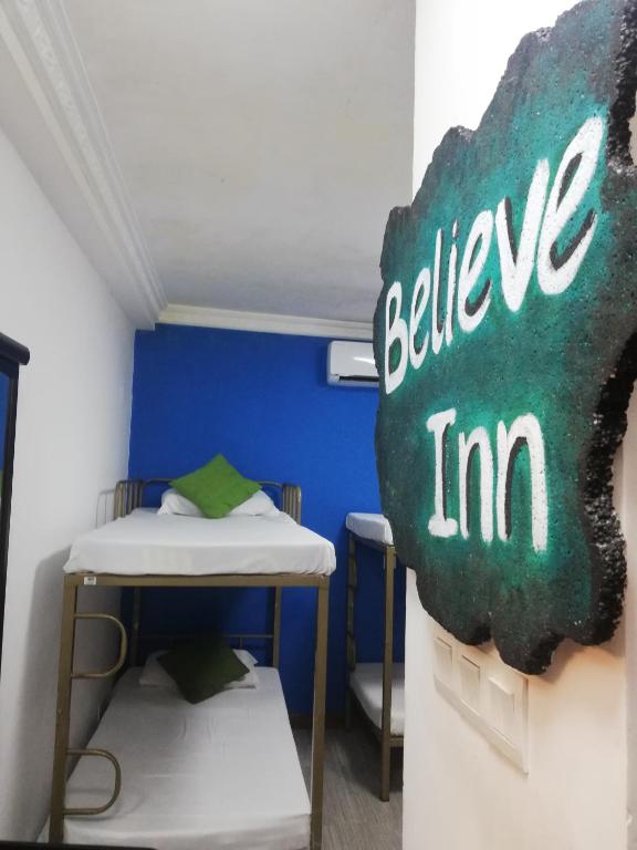 Postel nebo postele na pokoji v ubytování Believe Inn
