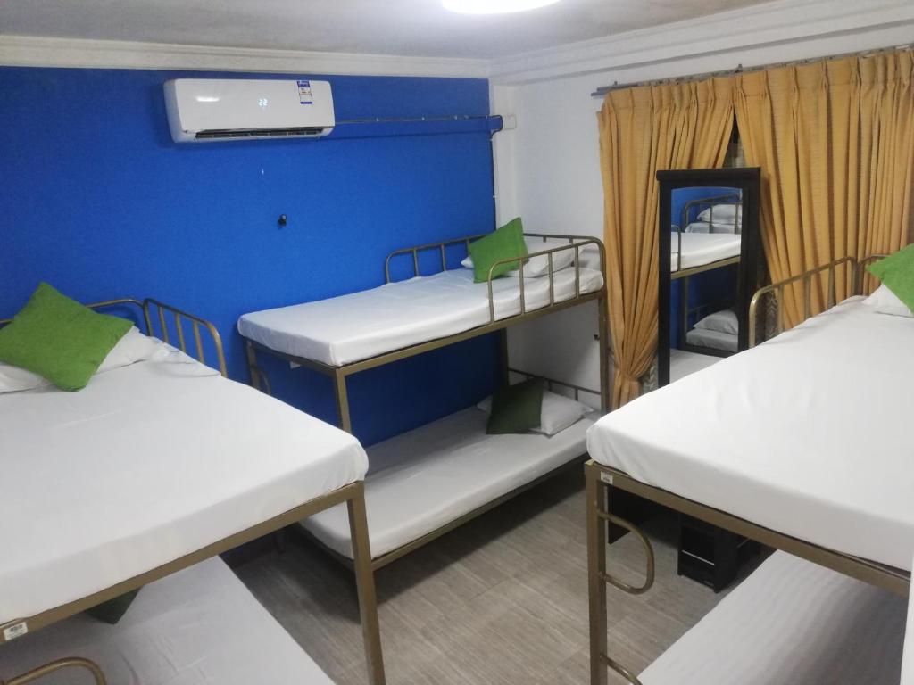Postel nebo postele na pokoji v ubytování Believe Inn