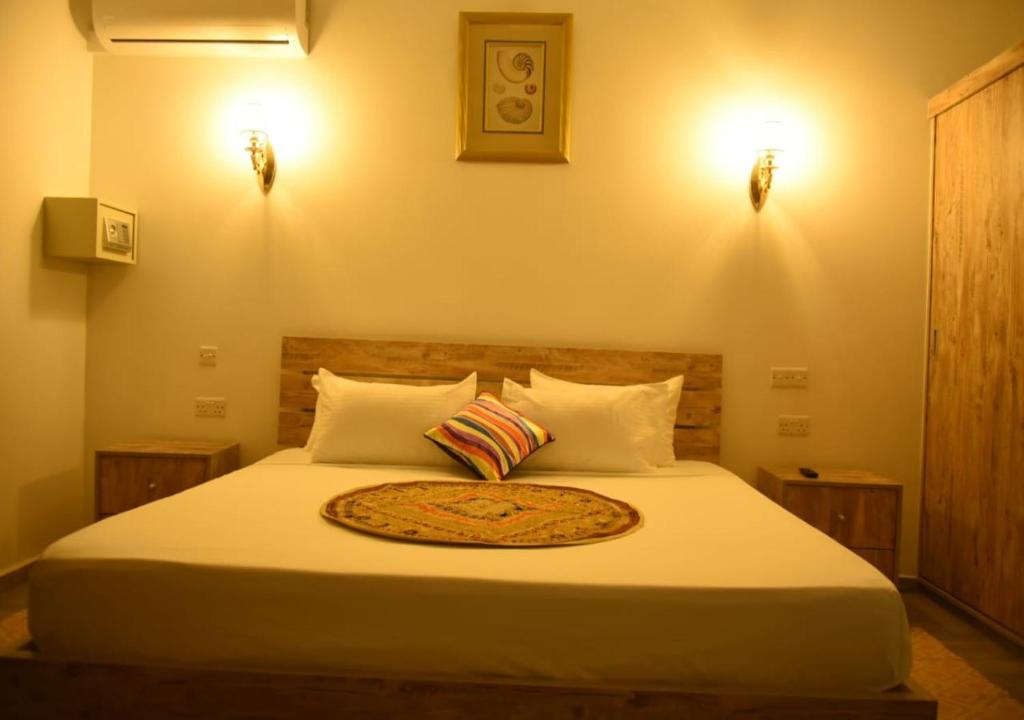 Postel nebo postele na pokoji v ubytování Easy Stay Residence