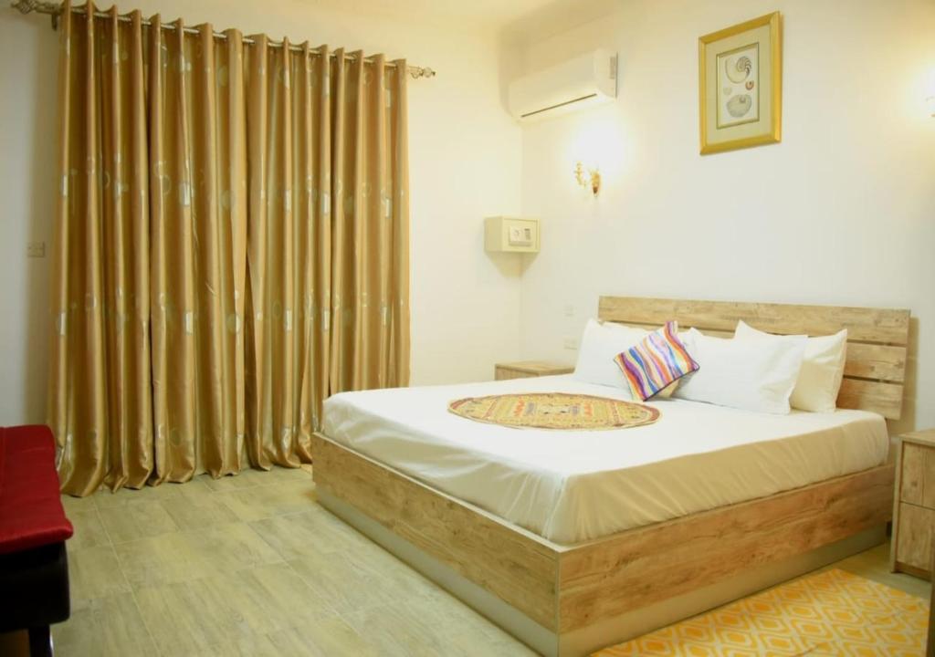 Postel nebo postele na pokoji v ubytování Easy Stay Residence