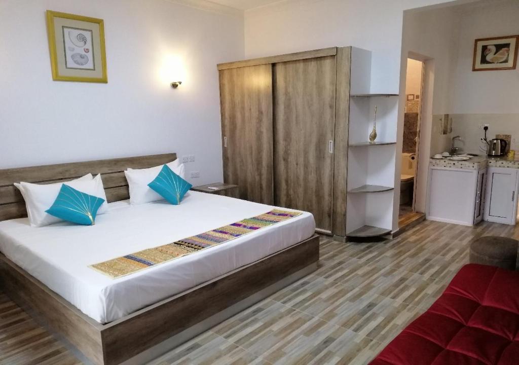 Postel nebo postele na pokoji v ubytování Easy Stay Residence