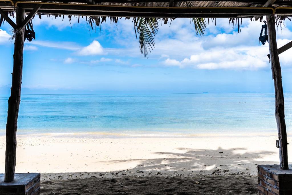 a view of the beach from a beach house at Isara Lanta Beach Resort in Ko Lanta