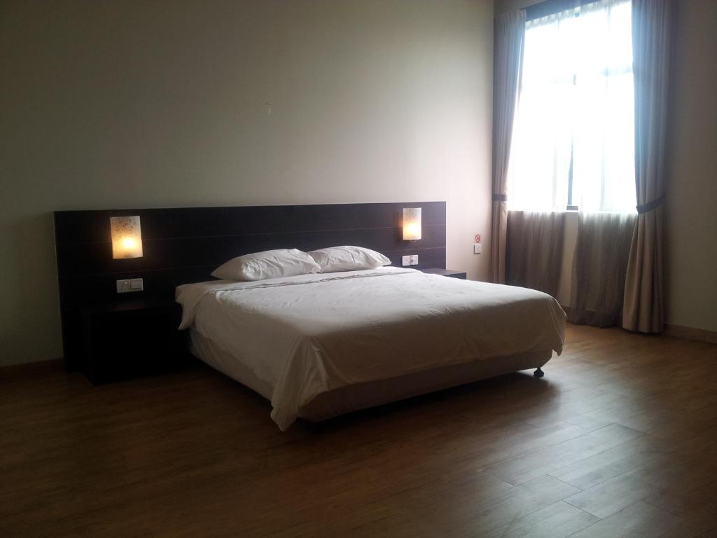 Postel nebo postele na pokoji v ubytování Tanjung Villa