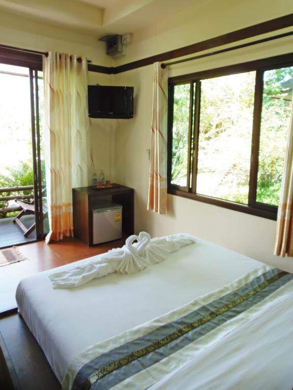 Postel nebo postele na pokoji v ubytování Pai My Guest Resort - SHA Plus