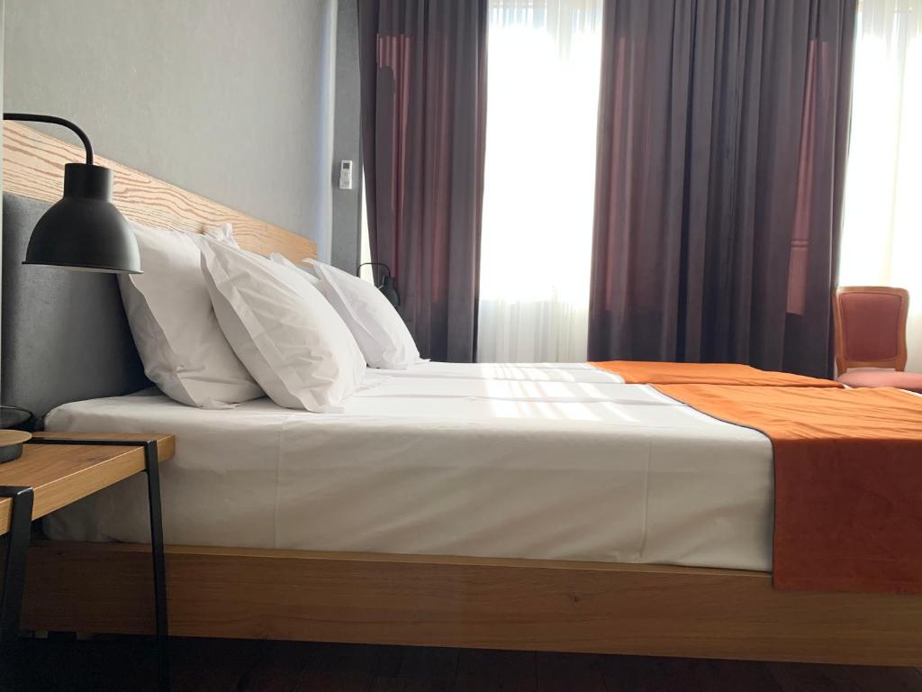 Postel nebo postele na pokoji v ubytování Hotel 1887
