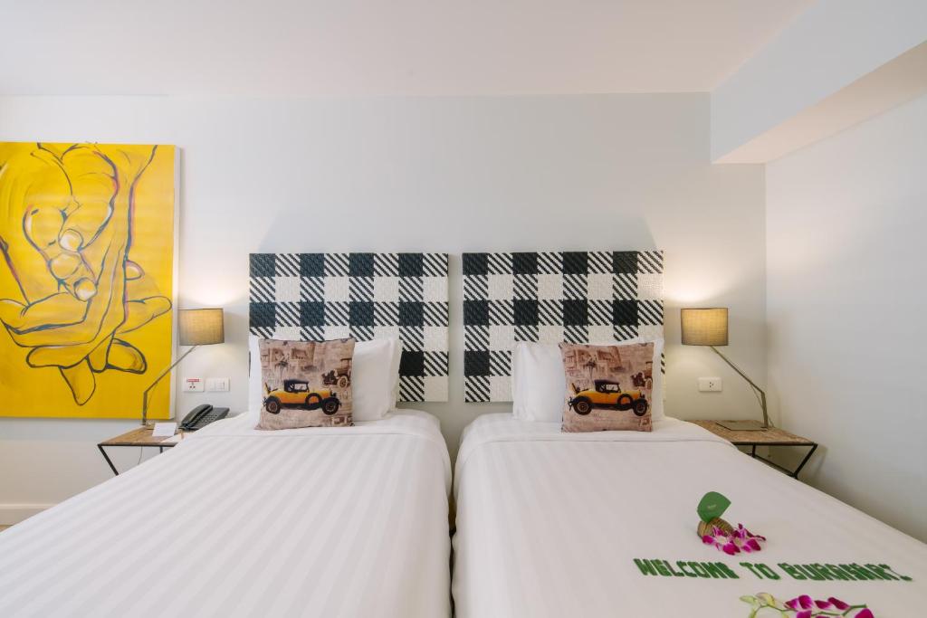 Postel nebo postele na pokoji v ubytování Burasari Phuket Resort & Spa