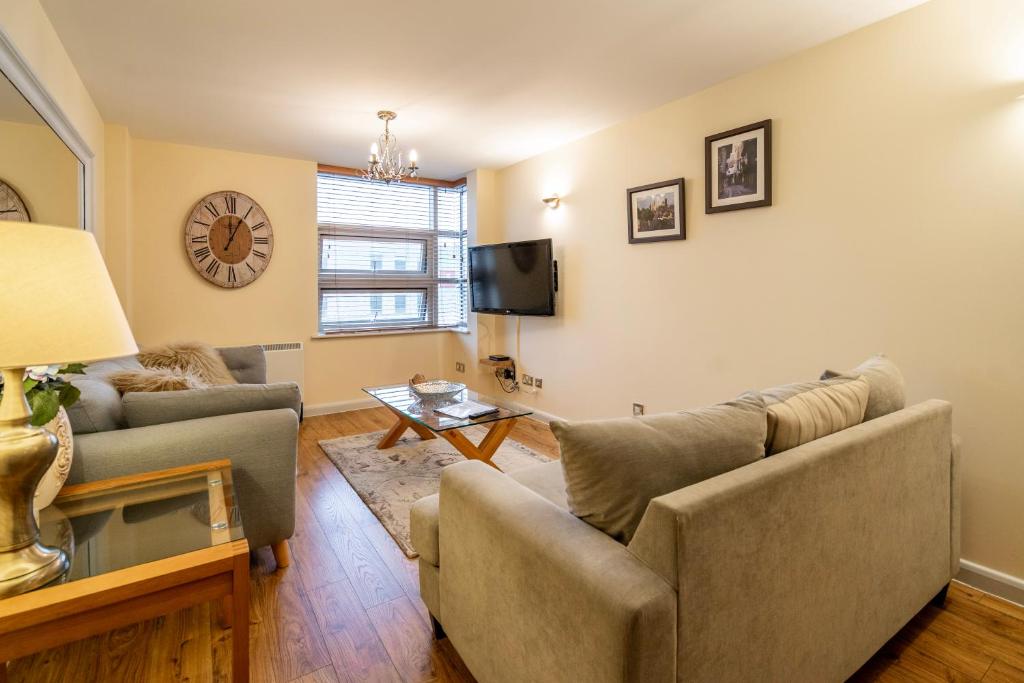 a living room with two couches and a tv at 316 Westgate in York